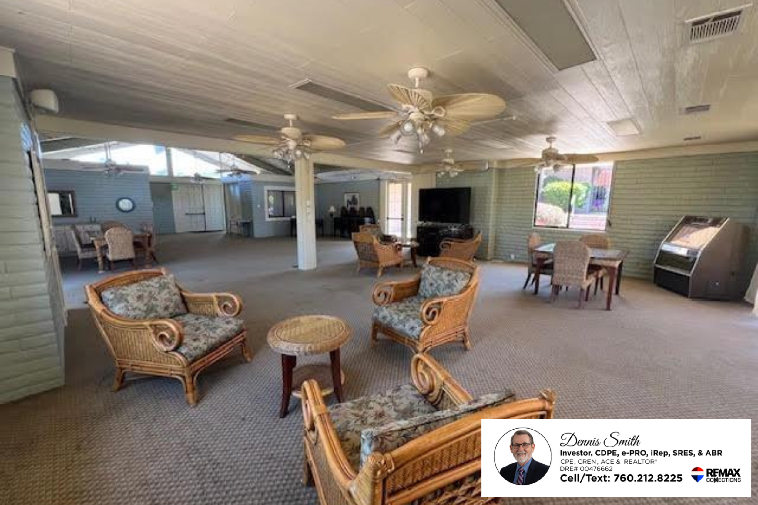 Large community clubhouse with open seating areas, ceiling fans, carpeted floors, and comfortable gathering spaces designed for social events, activities, and resident community gatherings.